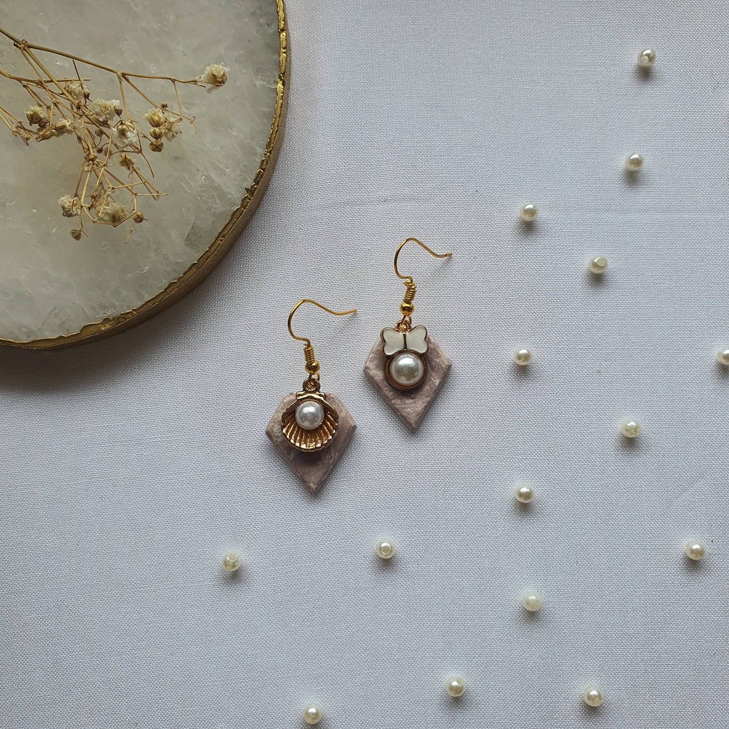 Asymmetric pearl earrings