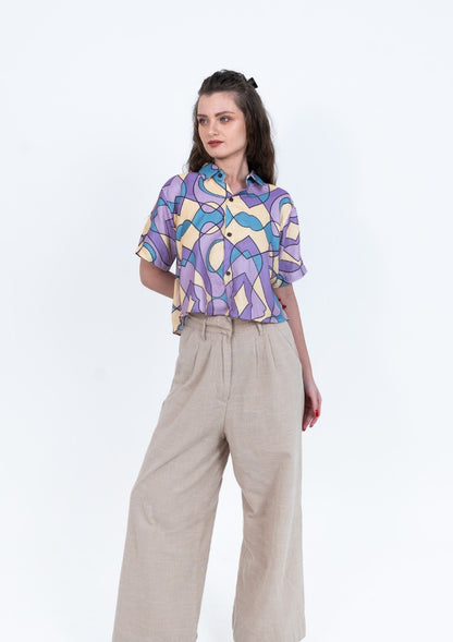 Cropped women's shirt in pastel purple blue and yellow abstract print with short sleeves