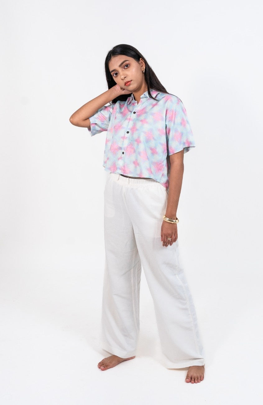 Cropped women's shirt in blue and pink abstract print with short sleeves
