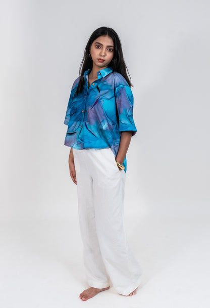 Cropped women's shirt in bright blue and purple marble print with short sleeves and thread work embroidery